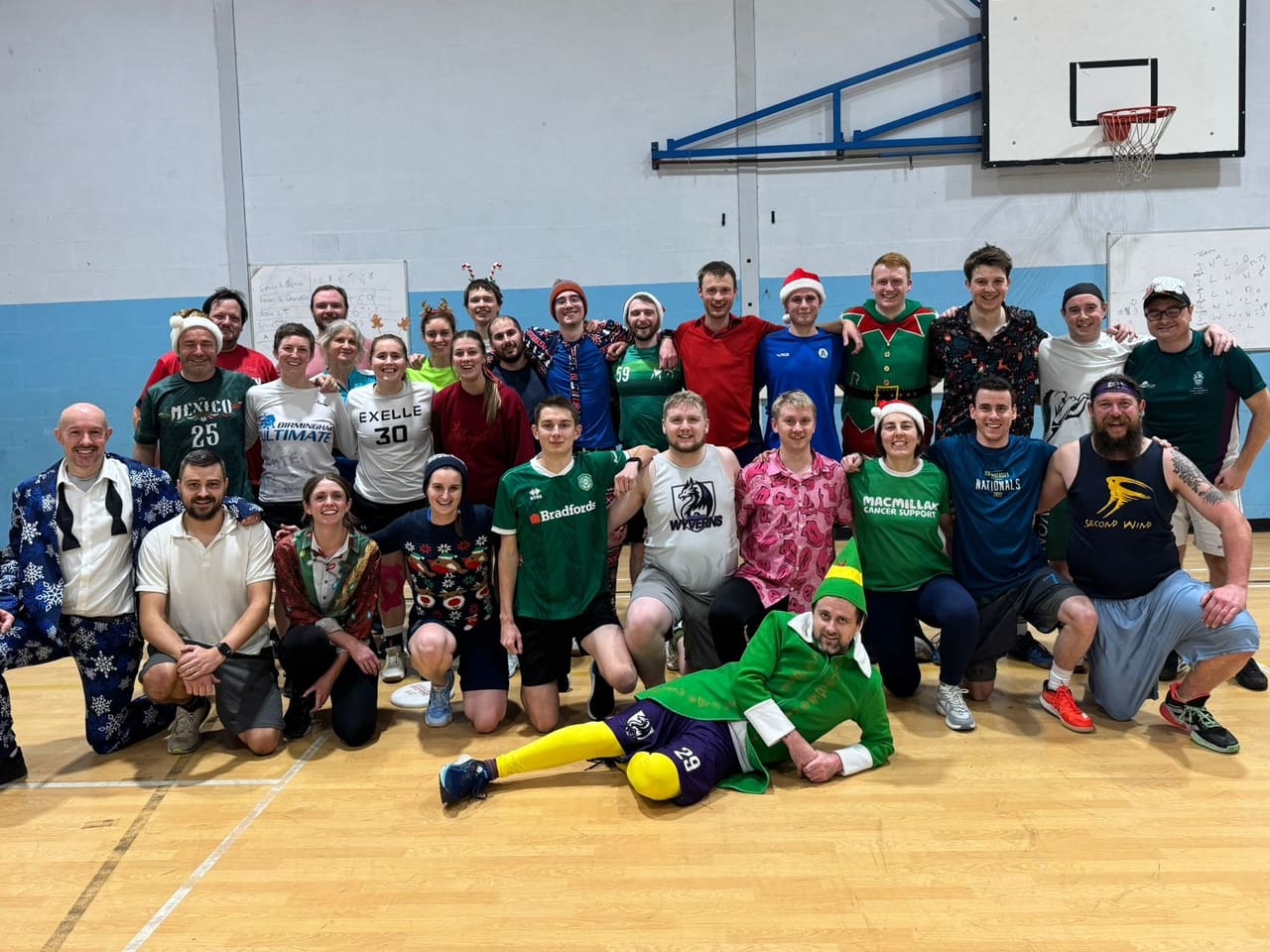 Taunton Wyverns players in Christmas jumpers posing together after an indoor session